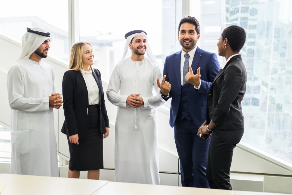 Business professionals engaging in a discussion at Path Link Partners office.